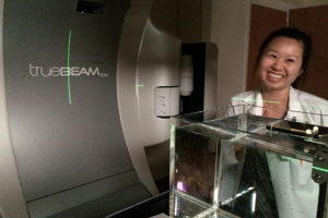 Jessie Huang-Vredevoogd setting up water tank for output QA on Varian TrueBeam STx.