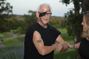 Karl Harter flexing for camera at 12th Annual Heads Up! Golf Fundraiser 2018