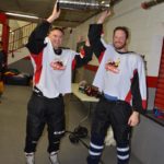 Drs. Michael Bassetti and Matthew Witek holding trophy cup.