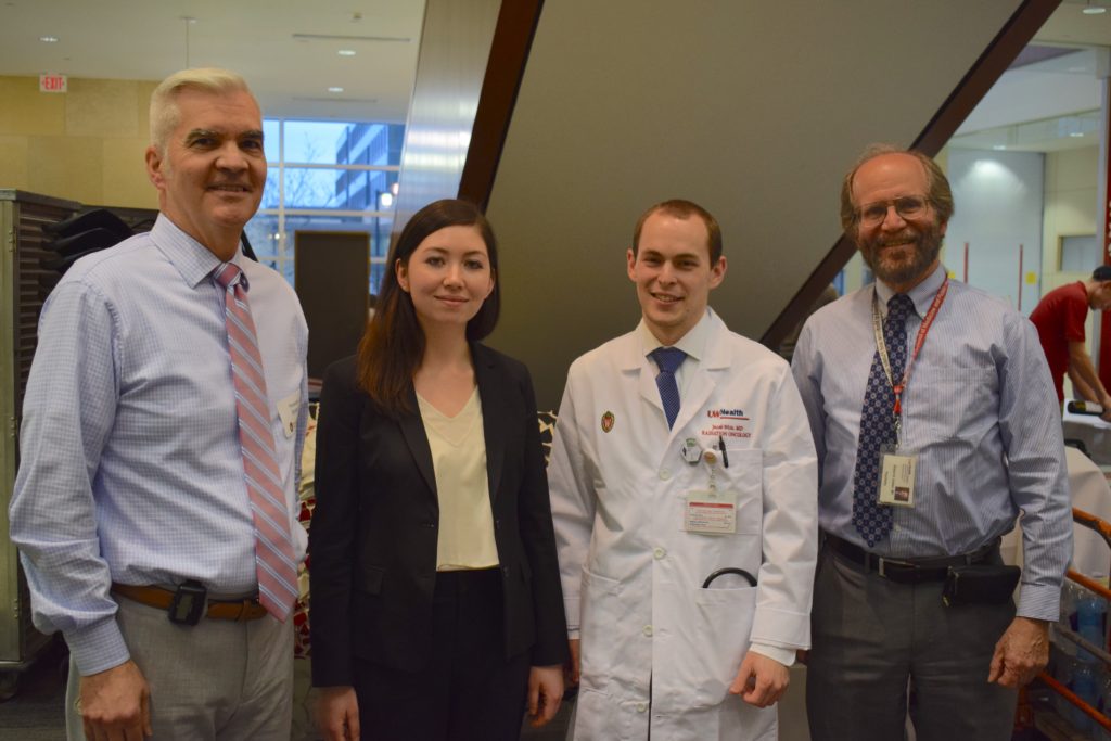 Howard Bailey, director of UW Carbone Cancer Research Center with Kristine Donahue, biology graduate student, Jacob Witt, UW radiation oncology resident and SMPH  Dean Robert Golden