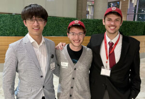 Image of Yuhao, Ken, and Nick at reception