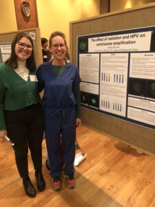 Picture of Emily Dunn and Dr. Cosper in front of poster