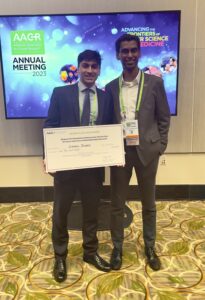 Shrey Ramesh and Saahil Javeri displaying their award at AACR