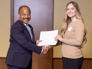 Christine Glitchev receiving Hilldale Award from Eric Wilcots - Interim Provost and Vice Chancellor for Academic Affairs