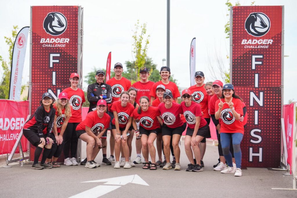 Group of people in red at Badger Challenge finish line