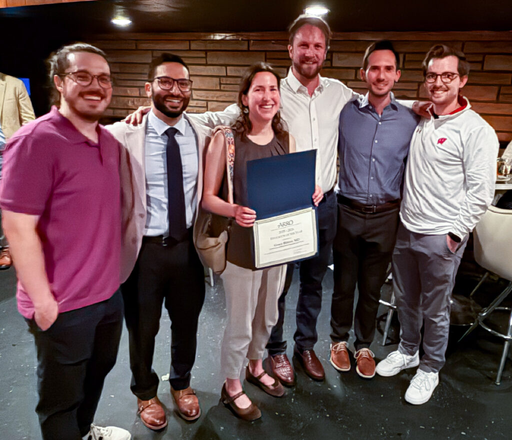 Mentor receives certificate from resident class
